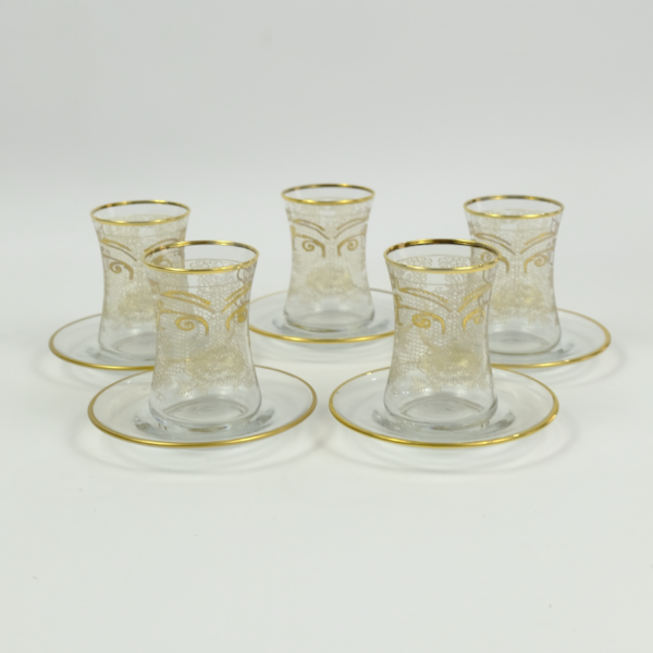 Set of 6 pieces of glass tea cups and saucer with a golden pattern art Dubai United Arab Emirates